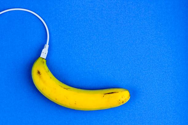 istock A fresh ripe banana connecting with a white usb charge cable. Creative concept of alternative electricity source, battery charger indicator, energy, healthy food. 1251475009
