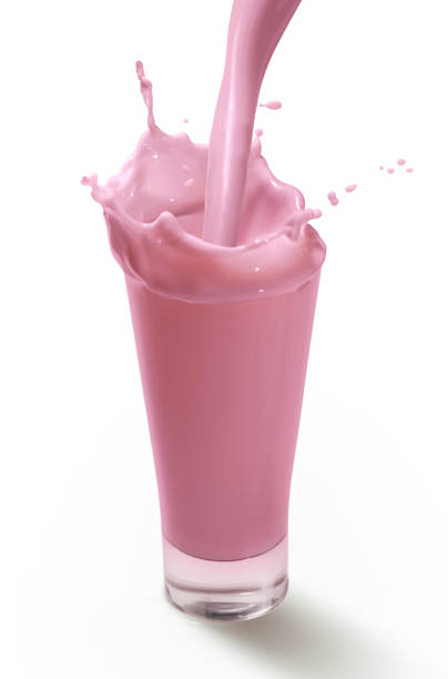 Splash in A Glass of Strawberry Milkshake stock photo
