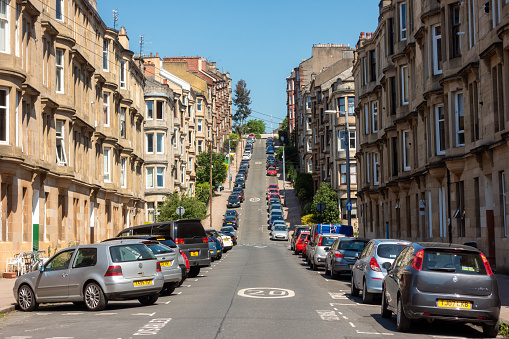 Glasgow, Scotland - Cars parked on the famously long and steep Gardner Street in Partick, Glasgow's West End.