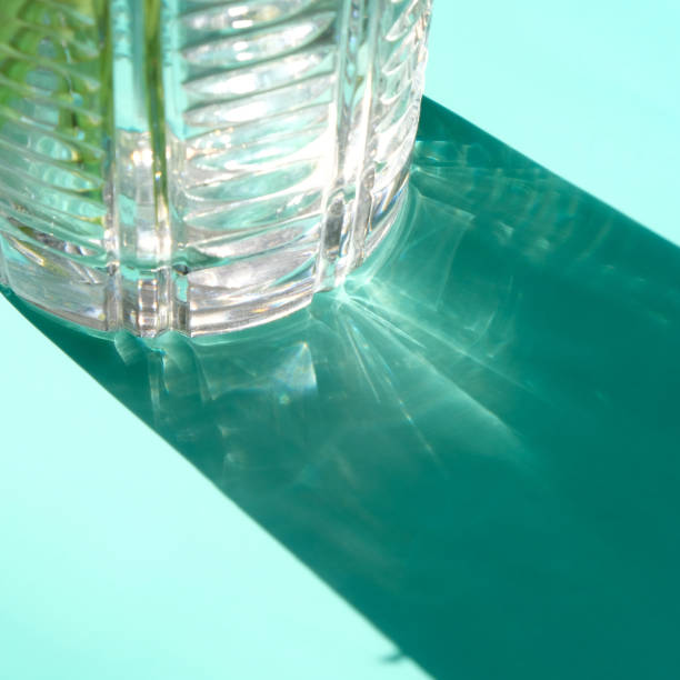 istock Trend shadow from a crystal vase on a blue background 1251476642