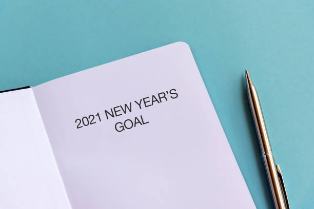 istock 2021 New Year's Goal text on note pad 1251478942