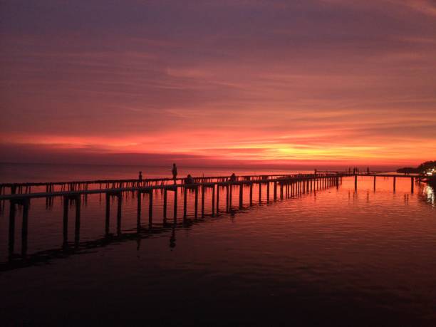 istock SunSet and Twilight Sky at Red Boardwalk Bridge 1251479040