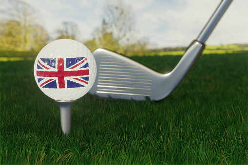 Concept of golf in the UK with the national flag on a golf ball.