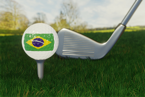 Concept of golf in Brazil with the national flag on a golf ball.