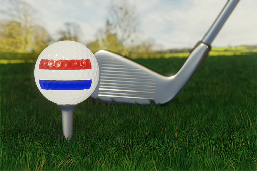 Concept of golf in The Netherlands with the national flag on a golf ball.