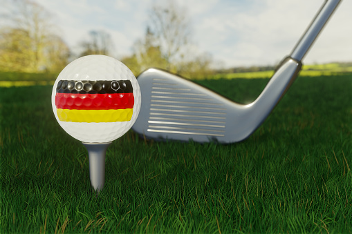 Concept of golf in Germany with the national flag on a golf ball.