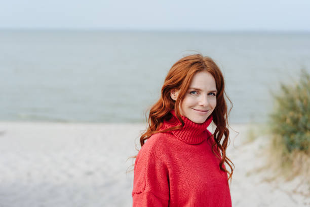 istock Friendly young woman with a beaming quiet smile 1251481926
