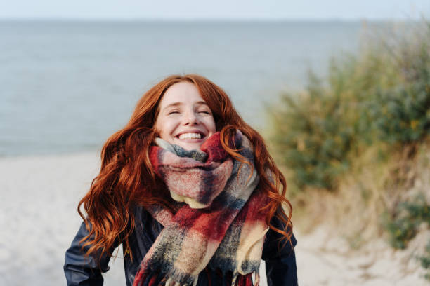 Joyful happy young redhead woman stock photo