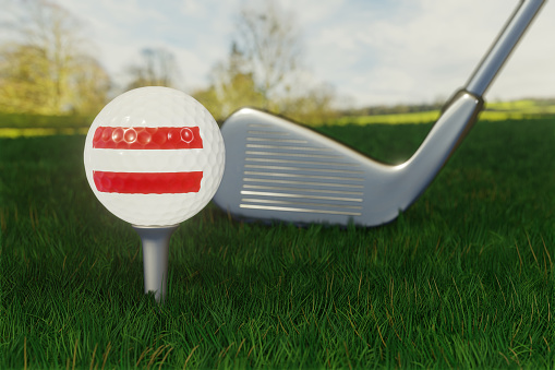 Concept of golf in Austria with the national flag on a golf ball.