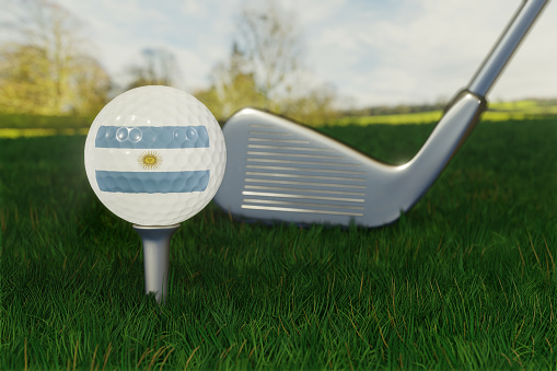 Concept of golf in Argentina with the national flag on a golf ball.