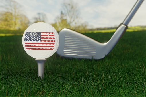 Concept of golf in USA with the national flag on a golf ball.