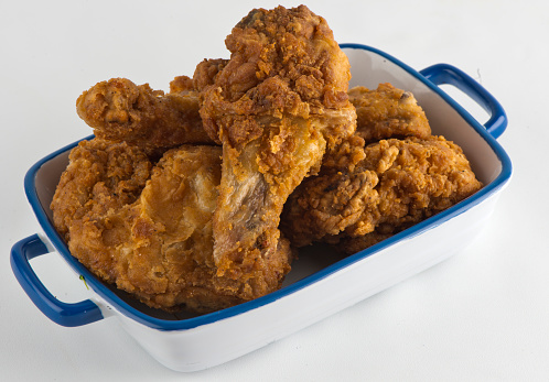 Fried Chicken. Homemade crispy southern fried chicken, battered & deep fried in cast iron skillet. Classic American southern, low country cuisine. Made from scratch chicken typically served w/ southern side dishes.