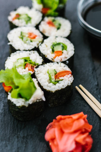 istock Maki roll with vegetables on a dark background 1251486468