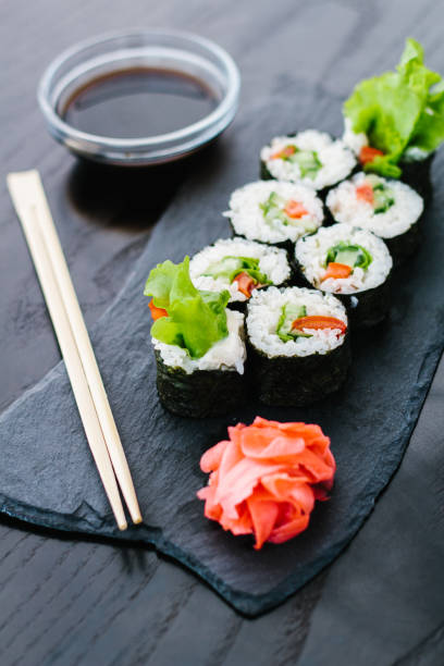 istock Maki roll with vegetables on a dark background 1251486474