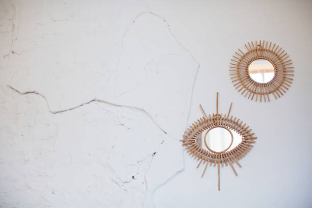 istock Vintage rattan mirrors on white wall 1251488499