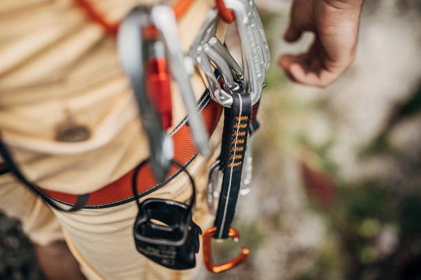 istock One man free climber preparing for climbing on the rock mountain 1251489531