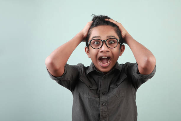 Portrait of a young boy with an excited face expression