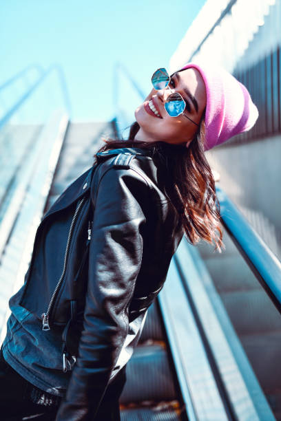 istock Cute Female Leaning On Escalator Stairs 1251492204