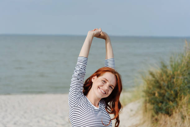 istock Young woman stretching and smiling with pleasure 1251492280