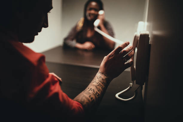 istock Young woman and her man sitting in visiting room 1251492472