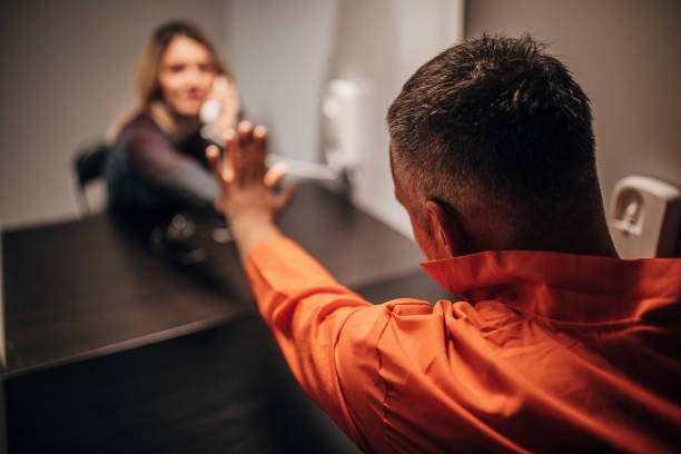 istock Young woman and her husband sitting in visiting room 1251492546