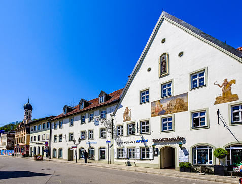 Wolfratshausen, Germany - April 23: famous bavarian old town with church and historic buildings of Wolfratshausen on April 23, 2020