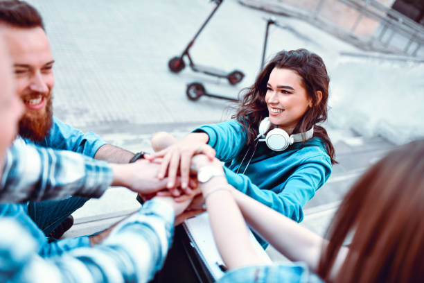 istock Friends Expressing Togetherness While Having Fun Together Outside 1251492830
