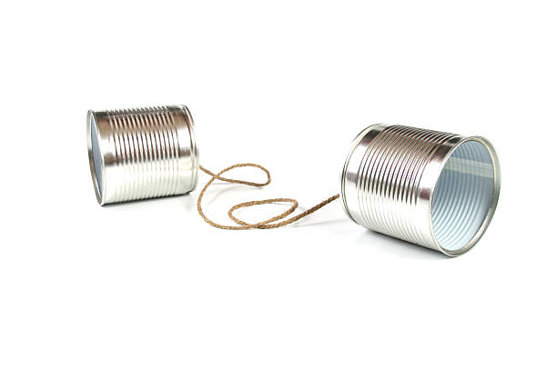 communication concept: tin can phone tin can phone isolated on white background string telephone stock pictures, royalty-free photos & images