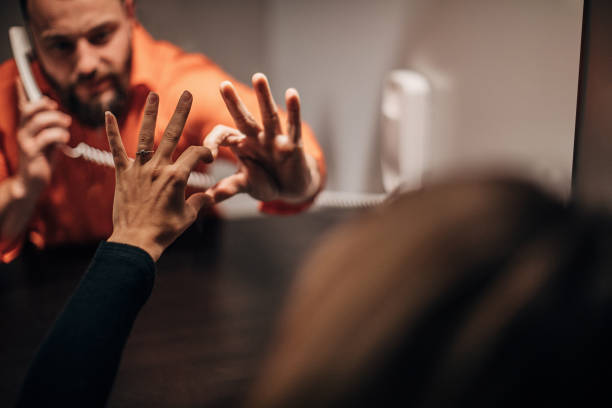 istock One young woman and her husband in visiting room 1251495492