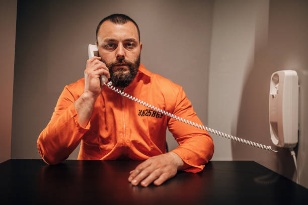 istock Male prisoner having a visit in visiting room 1251495907