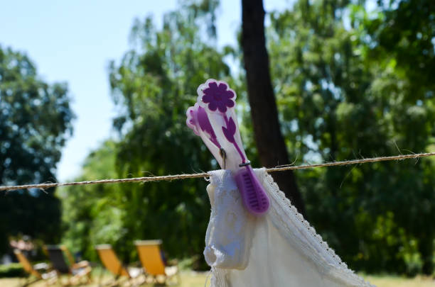 istock decorative clothespin on a rope in the park on a sunny day, selective focus 1251499451