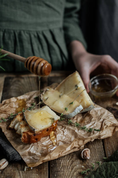 istock Pieces of dorblu cheese are poured with honey 1251500526