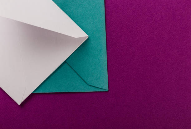 istock Colorful envelopes on a purple background. 1251500819