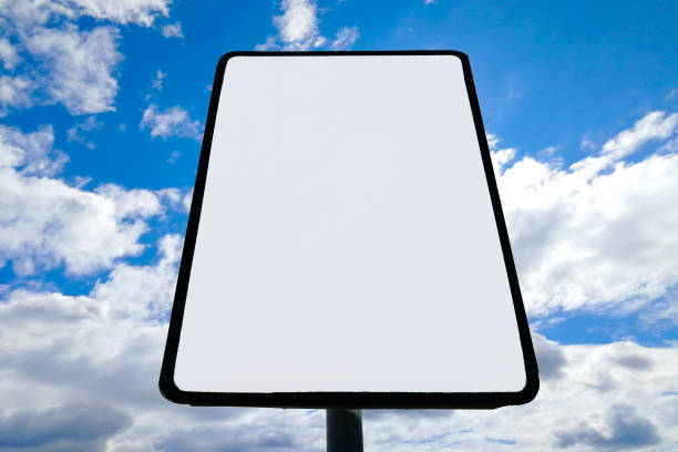 istock Road sign against clouds and sun. Front view. Copy spase 1251500942