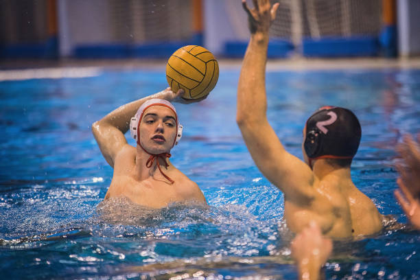 istock Two young men playing a water polo 1251502470