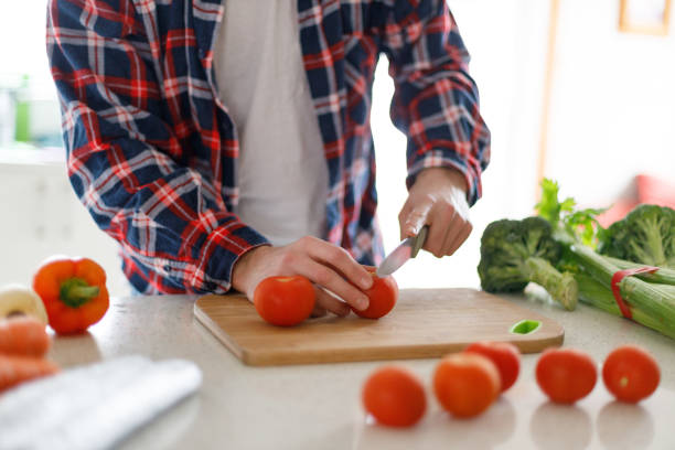 istock young man stay at home cooking 1251503088