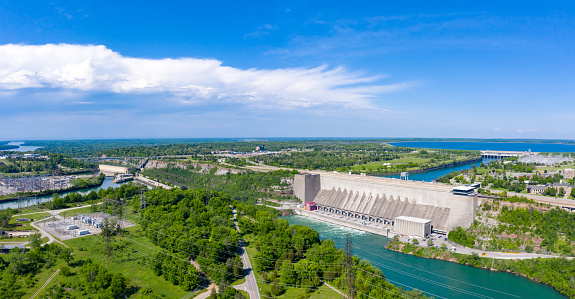 Working day on a hydroelectric power plant. Checking the condition of the power equipment, and analysing the data and the results of measurements with a mobile app.