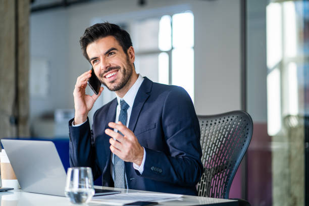 istock Handsome businessman sitting in modern office. 1251504091
