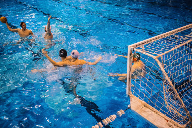 istock Group of men playing a water polo 1251505251
