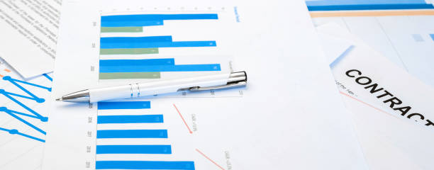 istock Contract, graph and pen on the table close up. Finance concept 1251506199