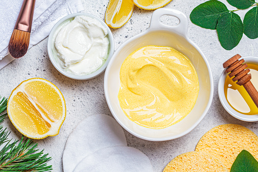 Preparation of turmeric face mask with honey and yogurt.
