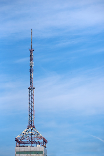 Telecommunications tower with a blue sky in the background
