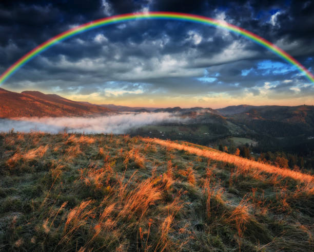 istock Rainbow over the Mountains. autumn morning in the Carpathians 1251512813