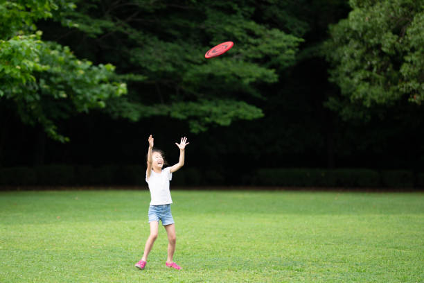 istock Girl playing with flying disc 1251517002