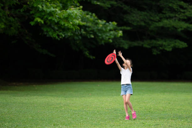 istock Girl playing with flying disc 1251517024