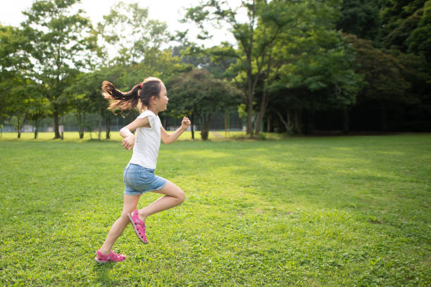 istock Girl running on the lawn 1251517030