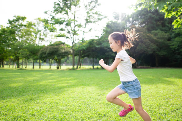 istock Girl running on the lawn 1251517042
