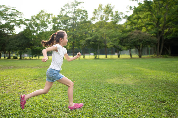 free-stock-photo-of-young-girl-running-through-grassy-field-download