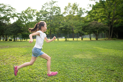 Girl running on the lawn