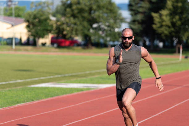 istock Young Male Athlete Running on Track 1251517394